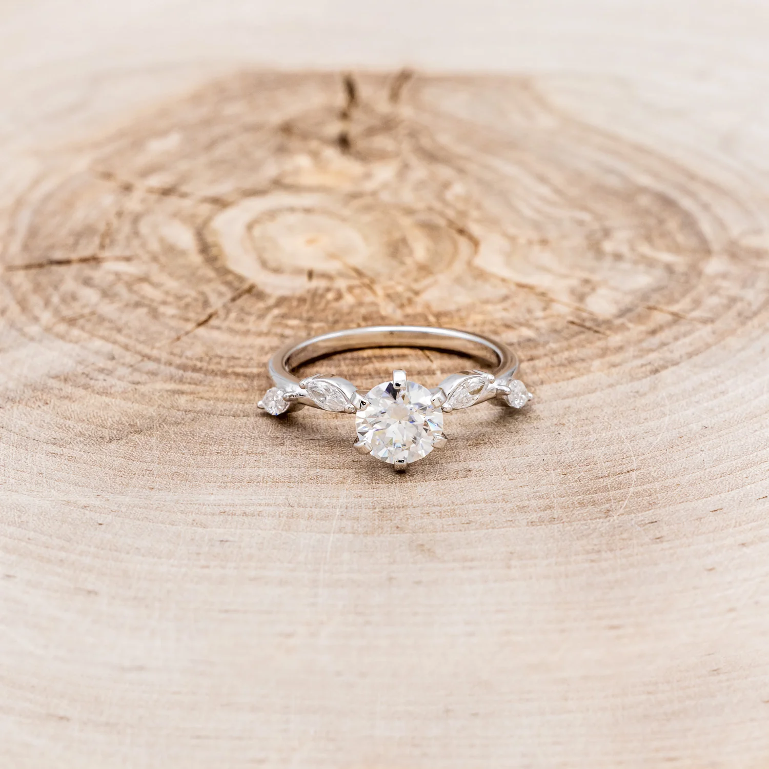 "FLORA" - ROUND CUT MOISSANITE ENGAGEMENT RING WITH MARQUISE CUT DIAMOND ACCENTS - Image 10