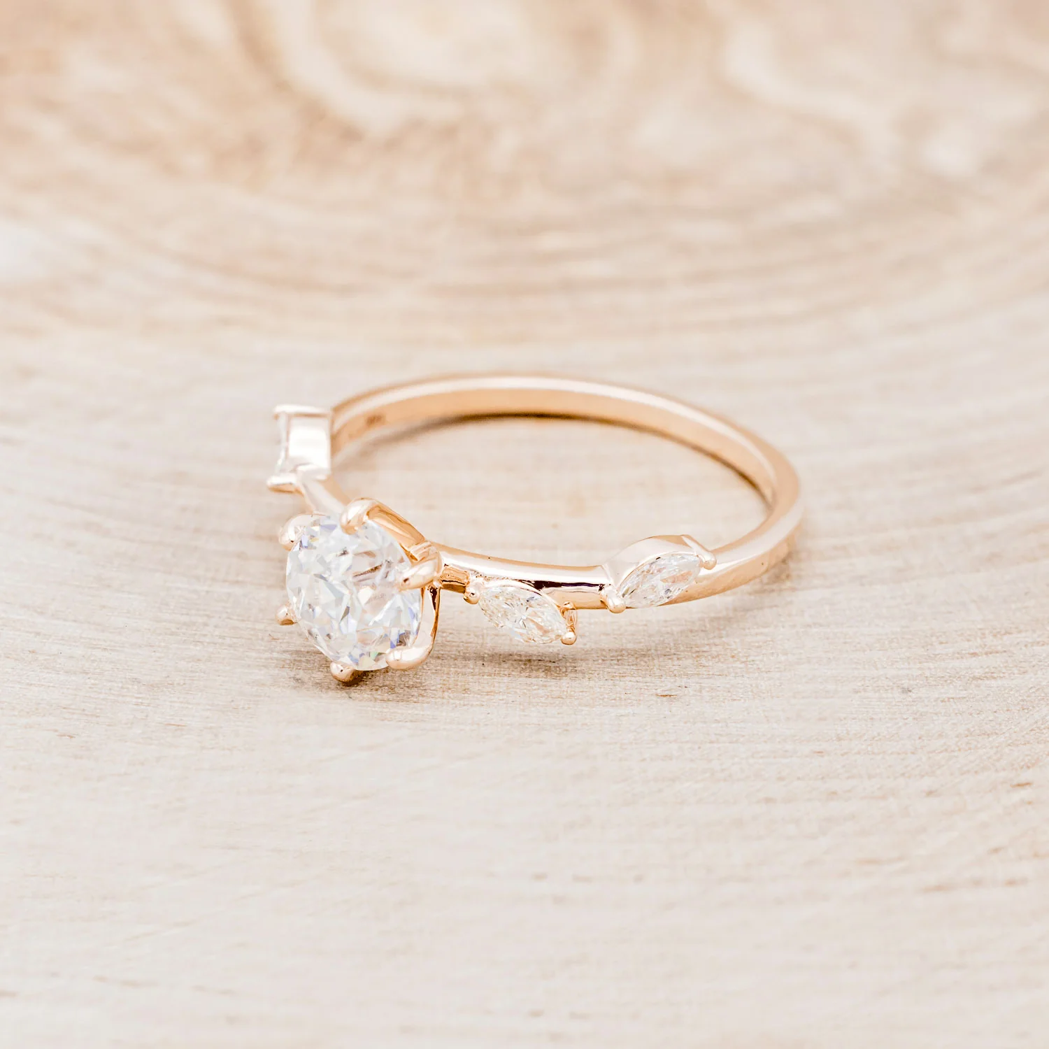 "FLORA" - ROUND CUT MOISSANITE ENGAGEMENT RING WITH MARQUISE CUT DIAMOND ACCENTS - Image 3