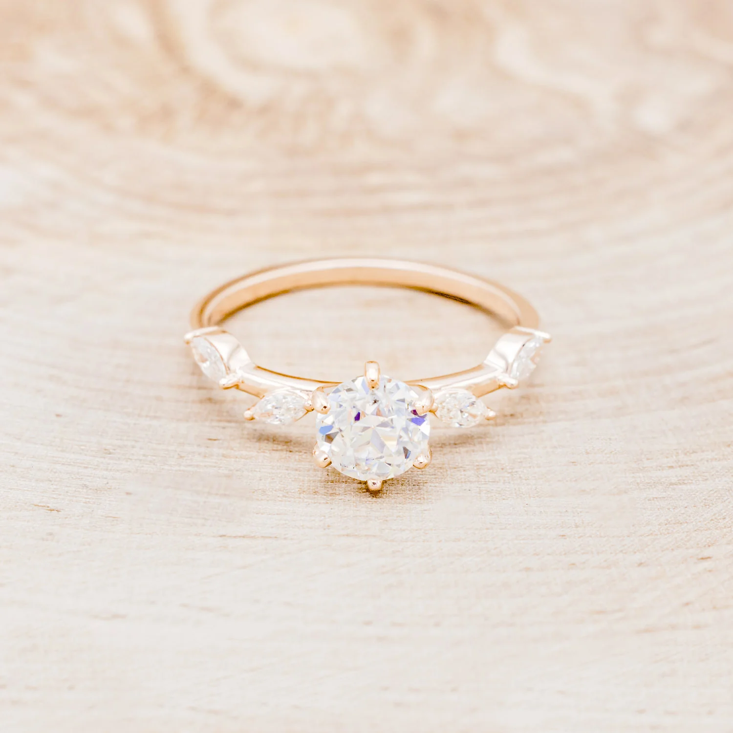"FLORA" - ROUND CUT MOISSANITE ENGAGEMENT RING WITH MARQUISE CUT DIAMOND ACCENTS - Image 4