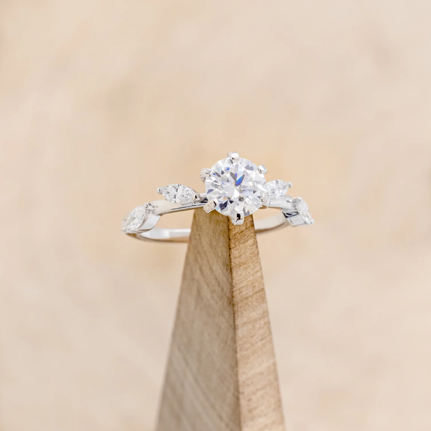 "FLORA" - ROUND CUT MOISSANITE ENGAGEMENT RING WITH MARQUISE CUT DIAMOND ACCENTS - Image 9
