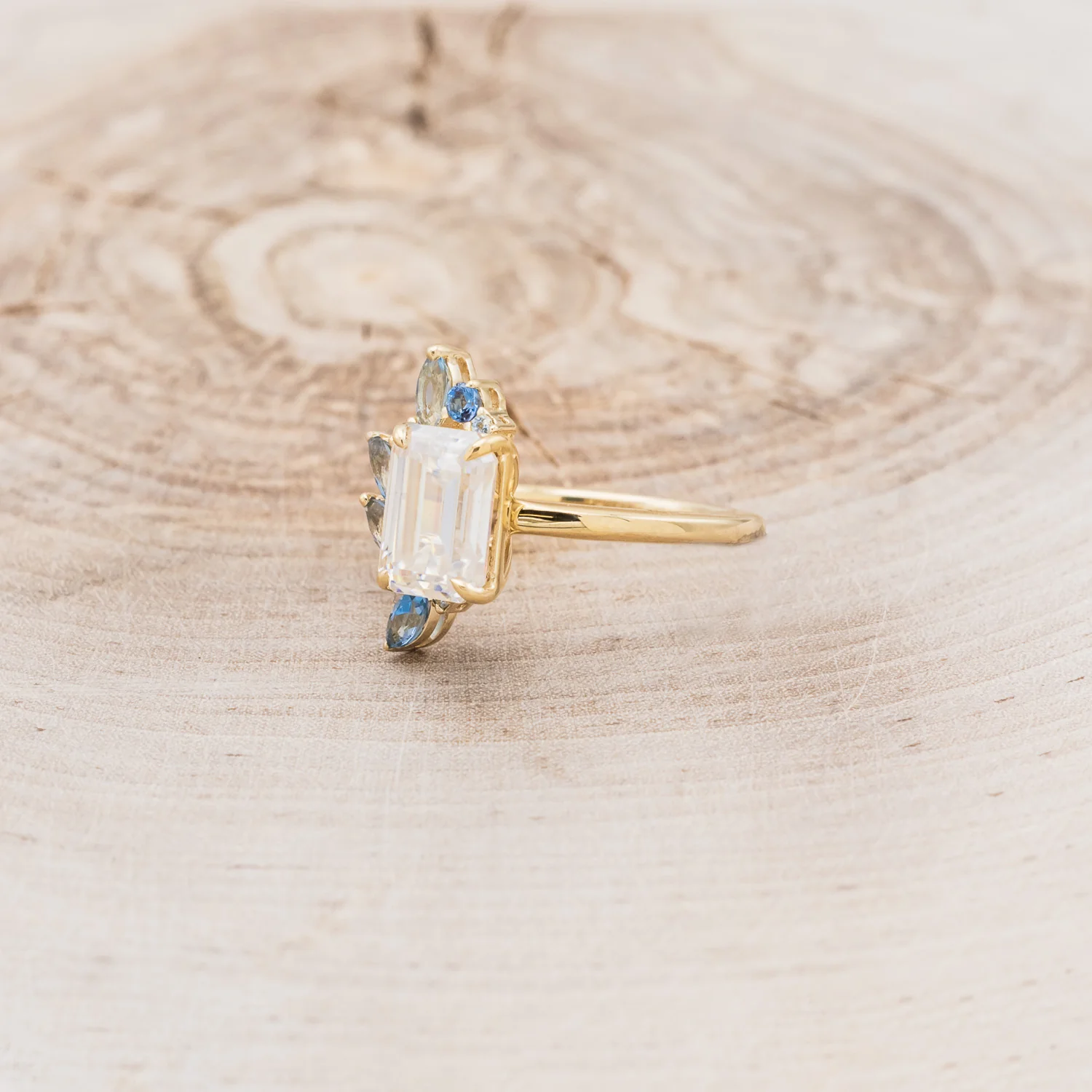 "ISABELLA" - EMERALD CUT MOISSANITE ENGAGEMENT RING WITH AQUAMARINE ACCENTS - Image 3