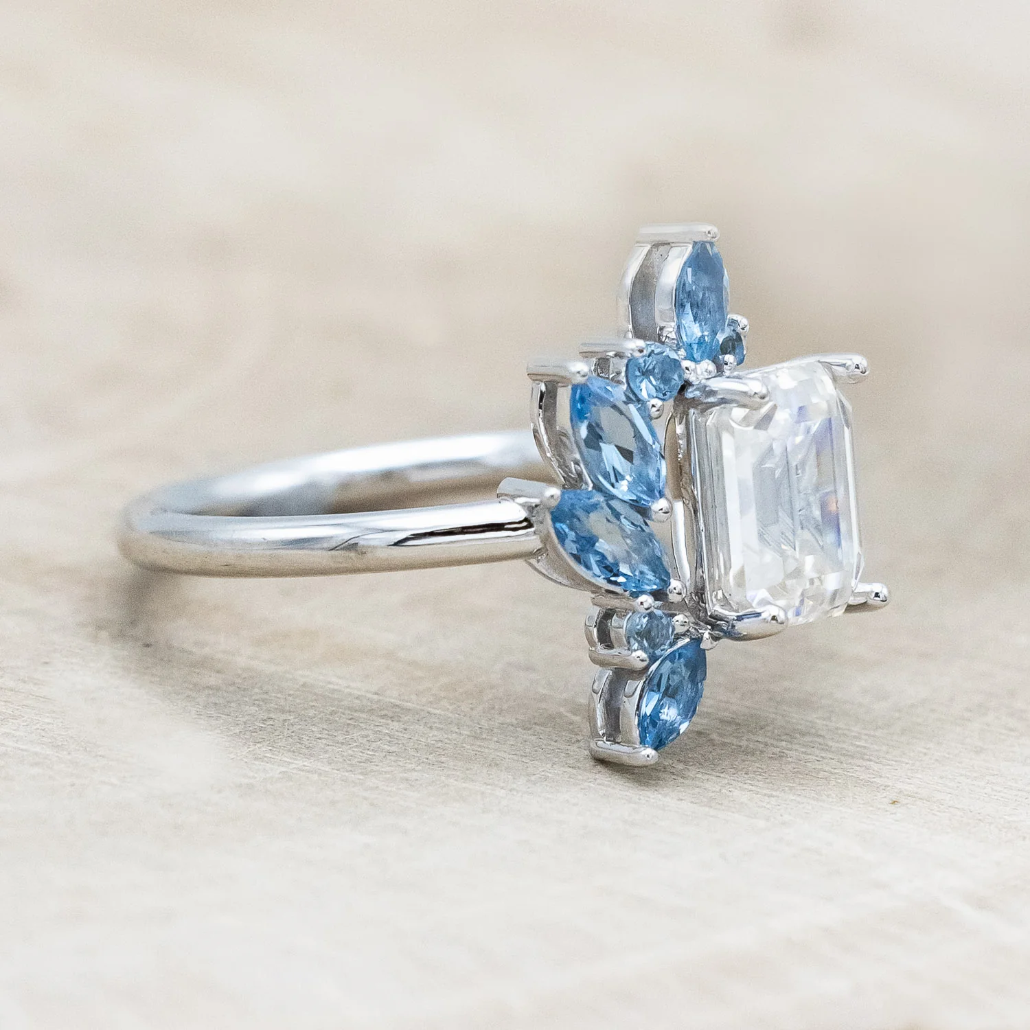 "ISABELLA" - EMERALD CUT MOISSANITE ENGAGEMENT RING WITH AQUAMARINE ACCENTS - Image 8