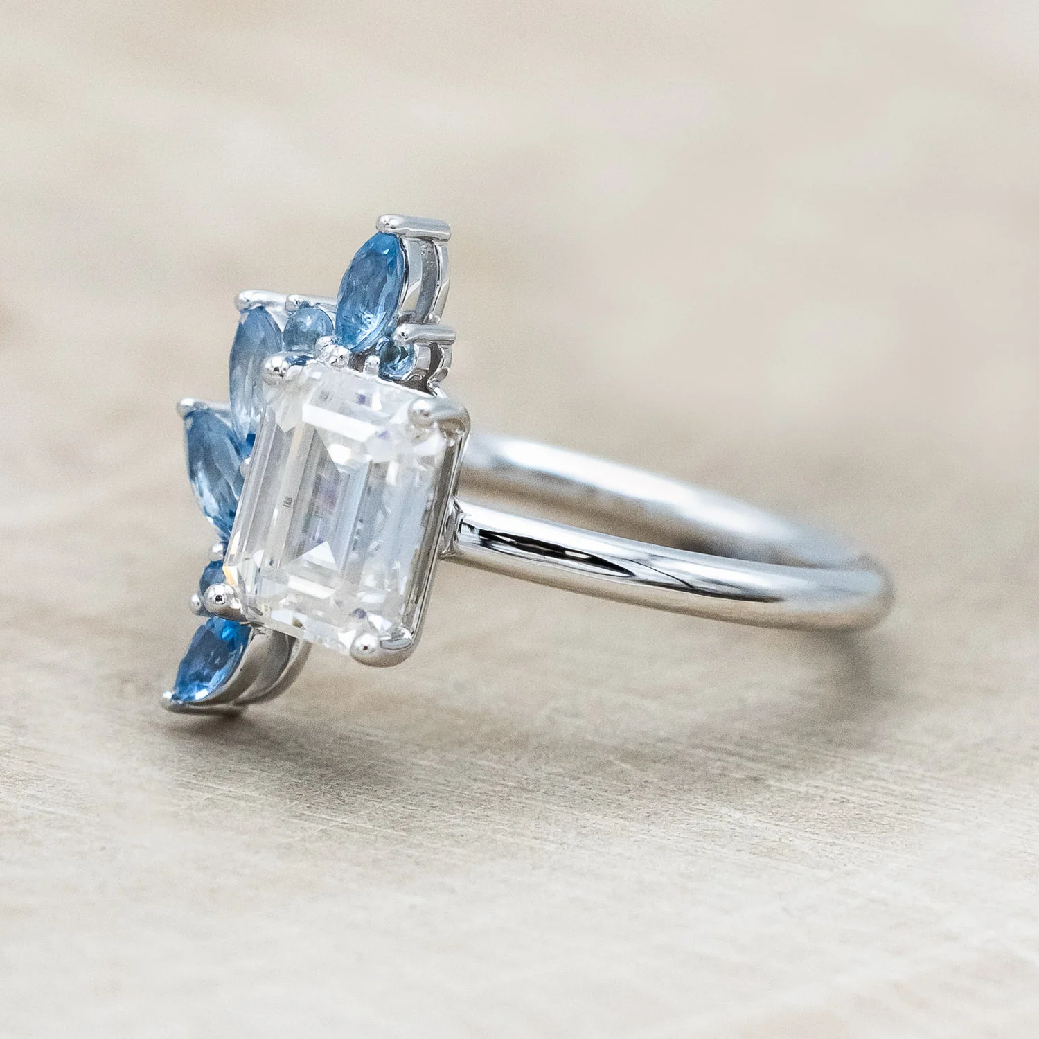 "ISABELLA" - EMERALD CUT MOISSANITE ENGAGEMENT RING WITH AQUAMARINE ACCENTS - Image 9