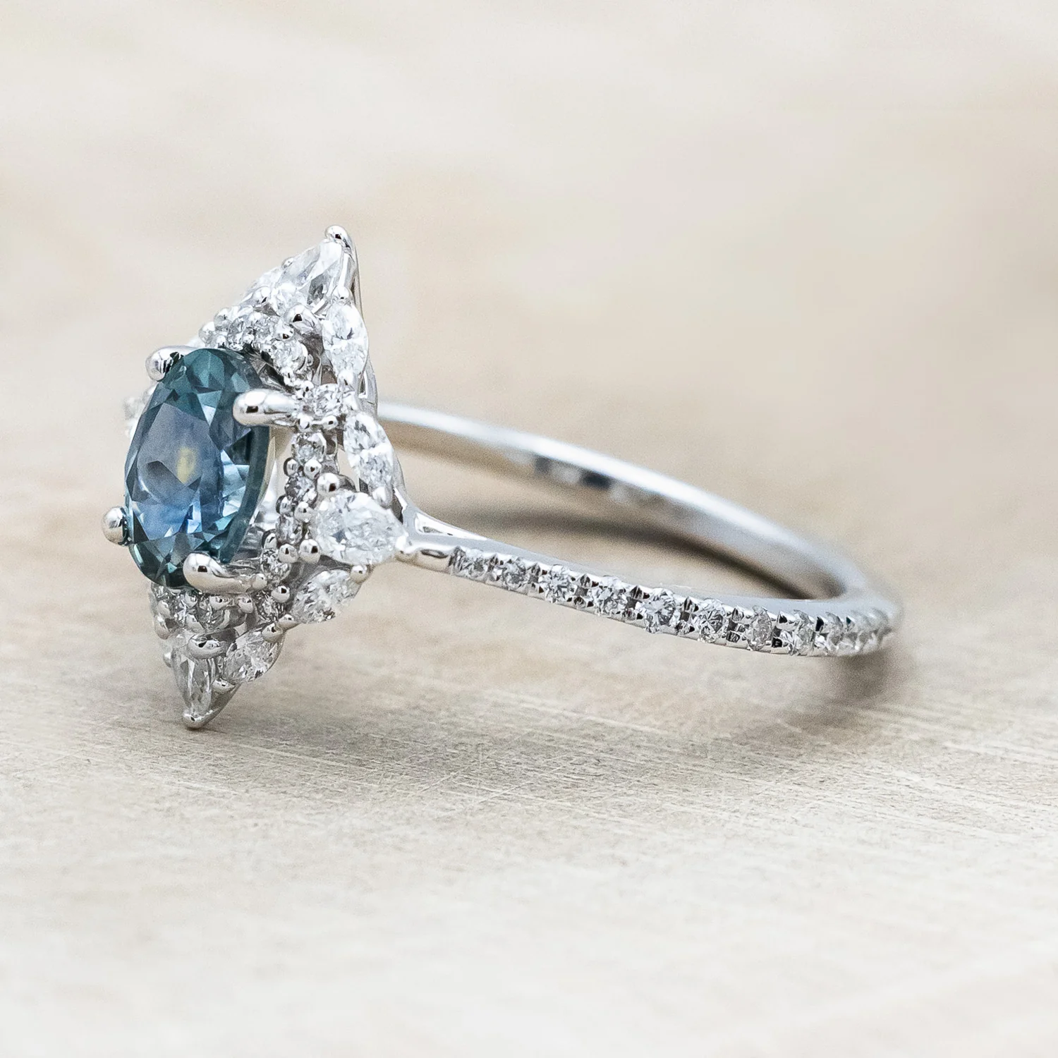 "NORTH STAR" - OVAL CUT MONTANA SAPPHIRE ENGAGEMENT RING WITH DIAMOND HALO & ACCENTS - Image 4