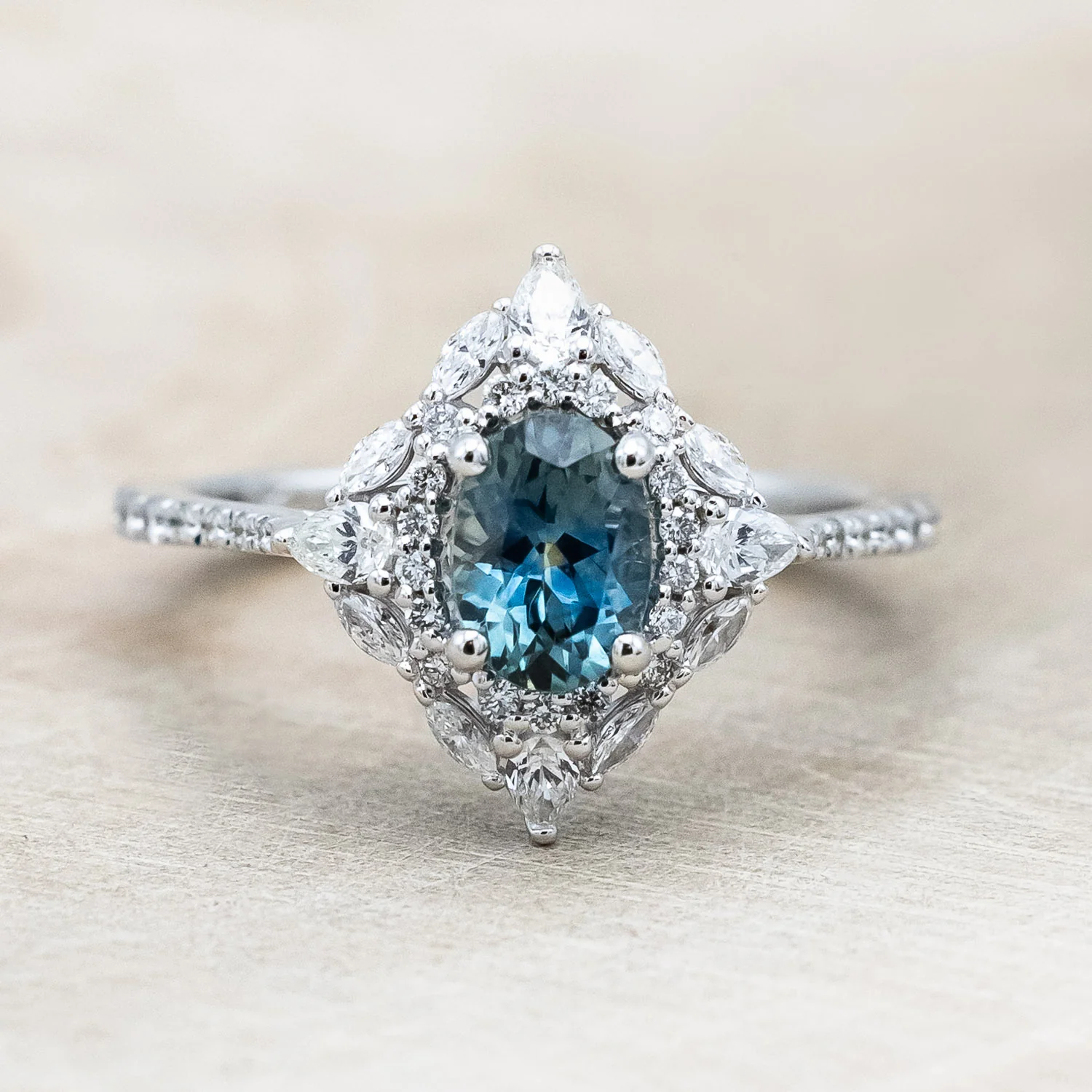 "NORTH STAR" - OVAL CUT MONTANA SAPPHIRE ENGAGEMENT RING WITH DIAMOND HALO & ACCENTS - Image 5