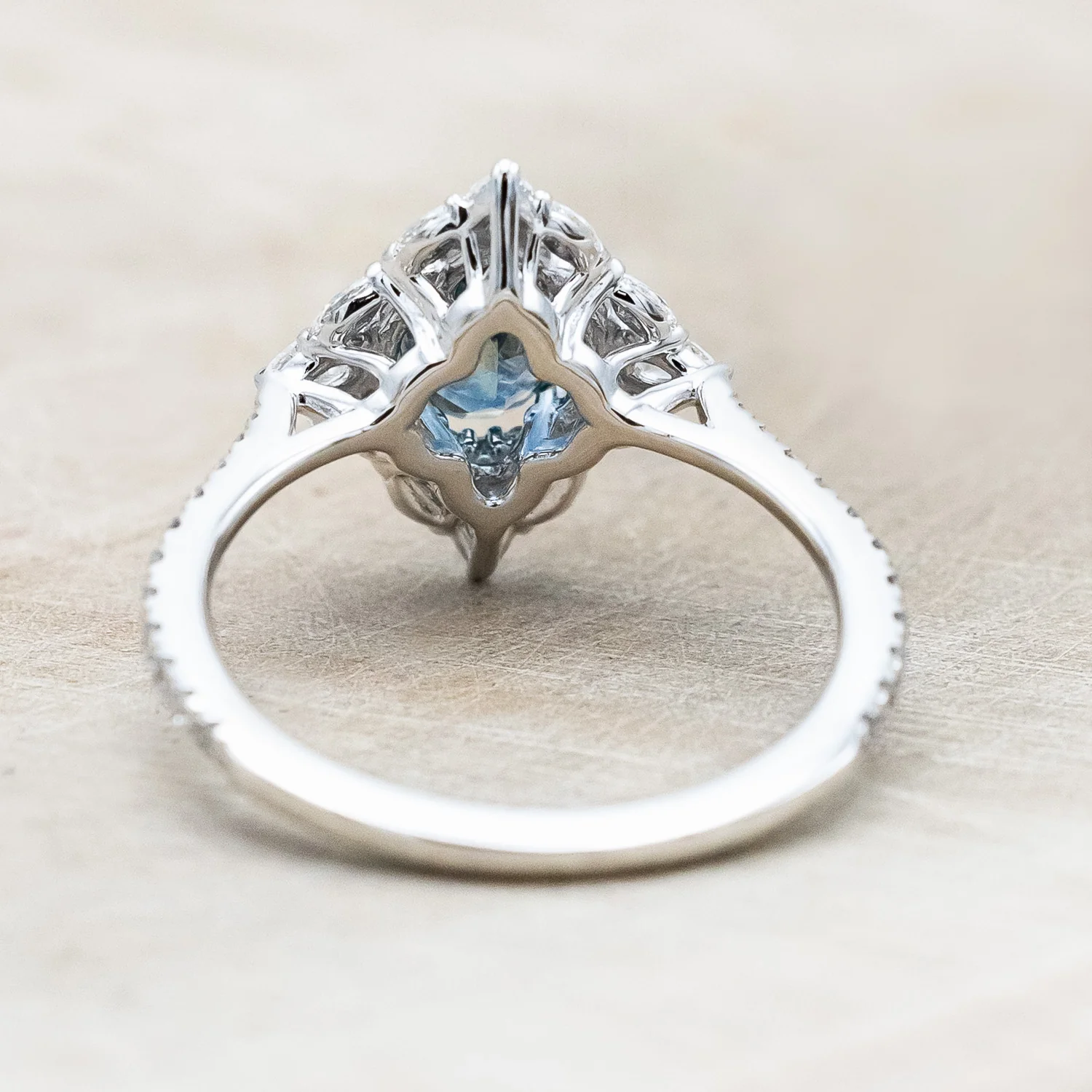"NORTH STAR" - OVAL CUT MONTANA SAPPHIRE ENGAGEMENT RING WITH DIAMOND HALO & ACCENTS - Image 6