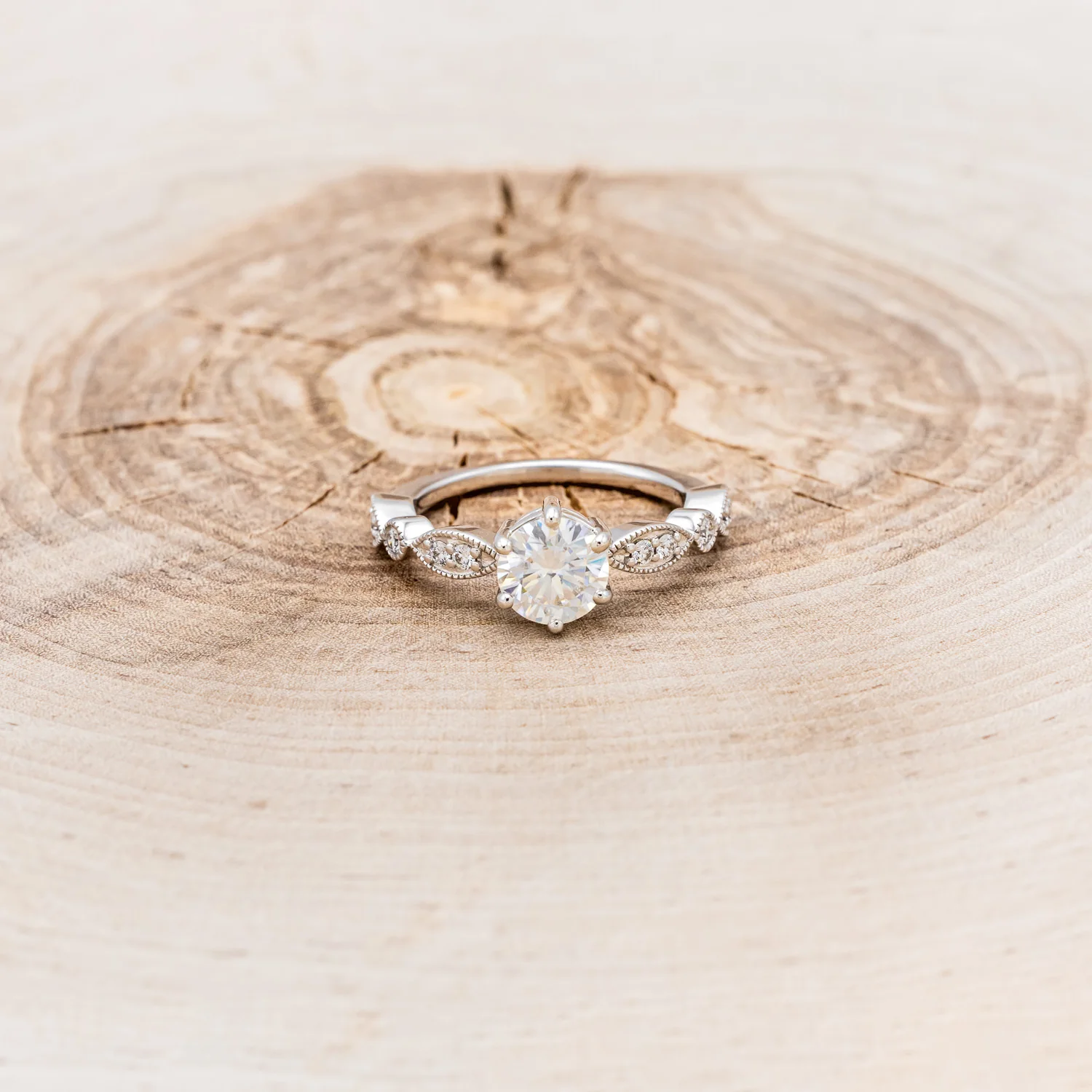 "ANISE" - ROUND CUT MOISSANITE ENGAGEMENT RING WITH DIAMOND ACCENTS - Image 4